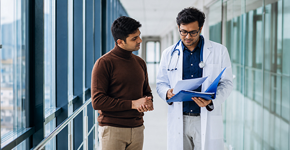 Patient guide — doctor discussing care with a patient in clinic